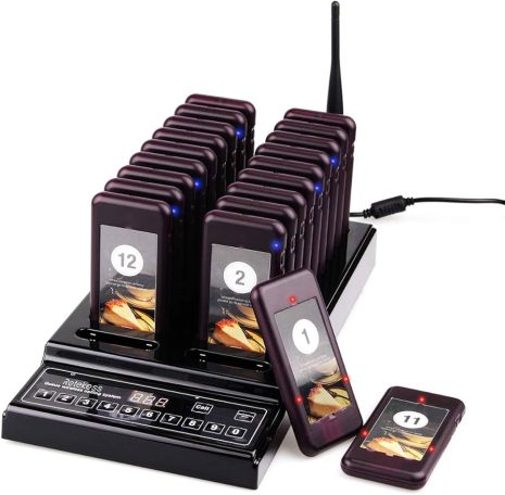 A charging station with multiple mobile devices arranged in rows.