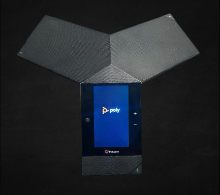 A folded electronic device displaying the PlayStation interface on a dark background.