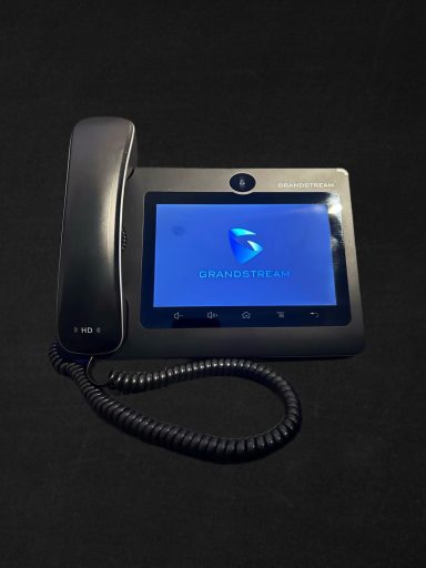 A black device with a touchscreen and a handset, displaying a blue logo.